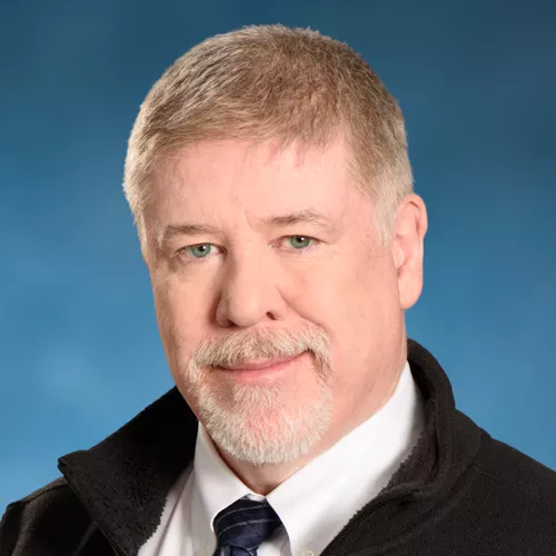 A portrait of William Cotter, President and CEO of Physicians Insurance.