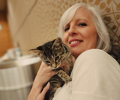PI employee holds cute kitten.